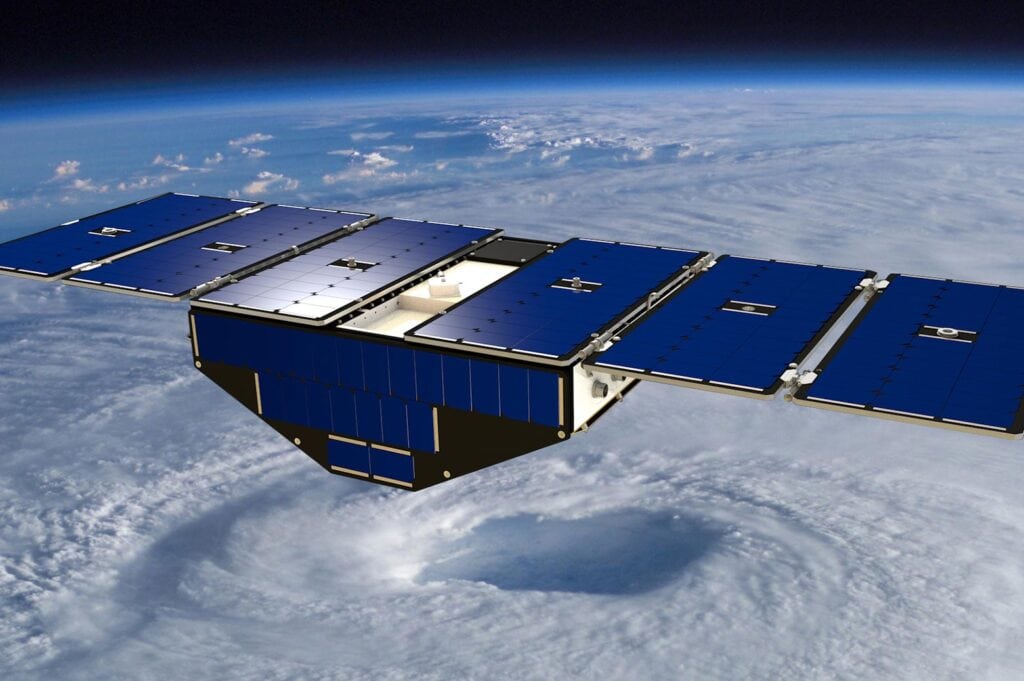 Blue triangle with wings in space over a circle of clouds.