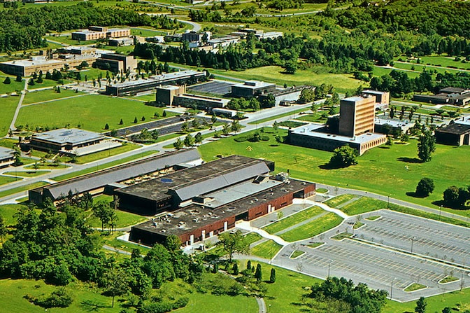Aerial image of buildings and green space.