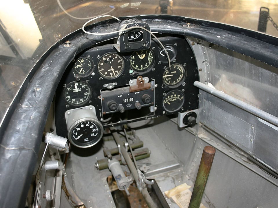 Aged cockpit of the Teal, showing various dials and instruments.