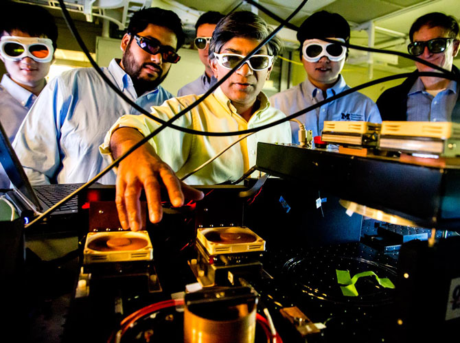 group of researchers wearing eye protection