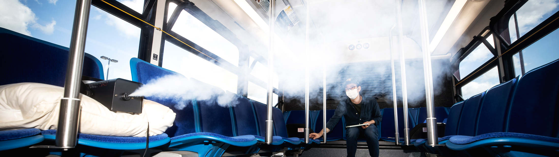 Kwang Hee Yoo, ME Researcher, measures the flow of aerosols in a University of Michigan blue bus.