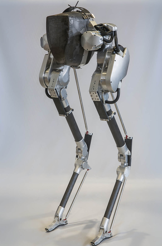 image of bipedal robot named cassie with metal body and legs in the shape of a bird