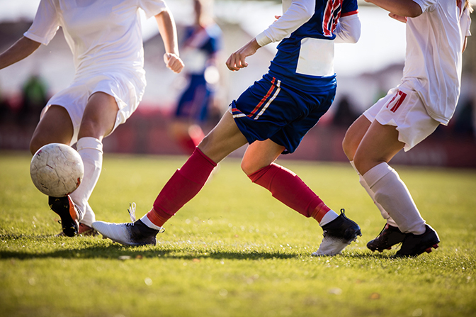 stock image of soccer players playing on a field