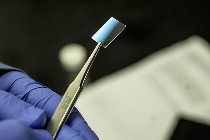 Thin polymer film held a researcher's tweezers