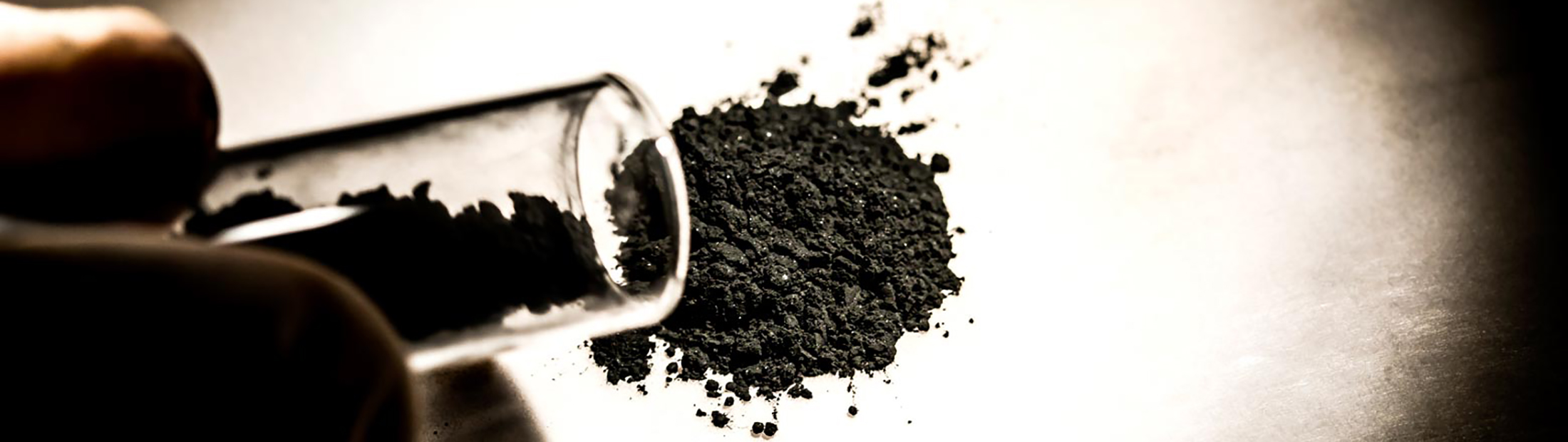 a close up image of a black, copper selenide powder
