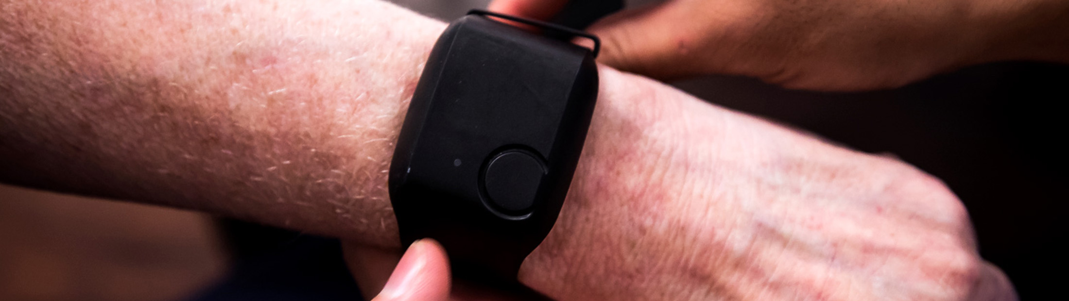 Close up of wearable sensor watch on senior citizen's wrist