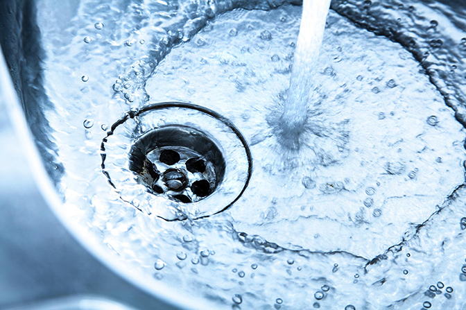 image of water pouring down from tap