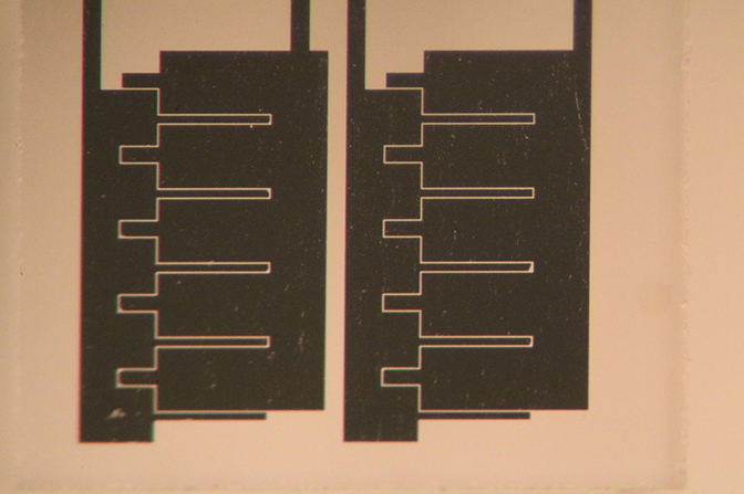 A diagram of two side-by-side black devices.