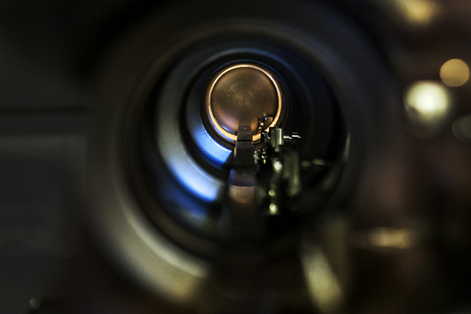 An inside view of a hollow metal cylinder.