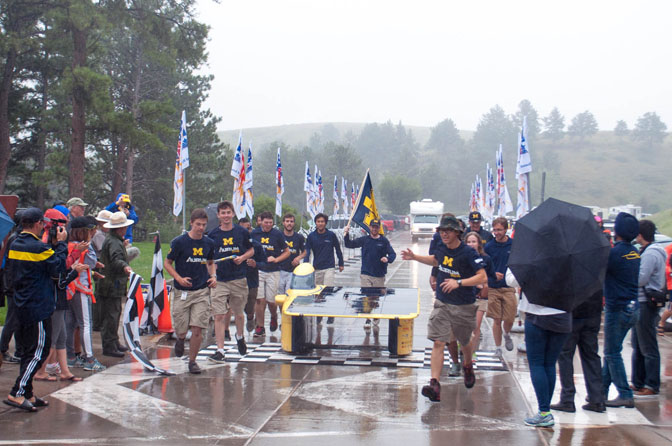 Solar car crossing finish line.