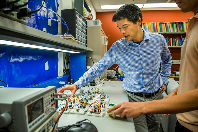 Dr. Fu gesturing towards an accelerometer sensor