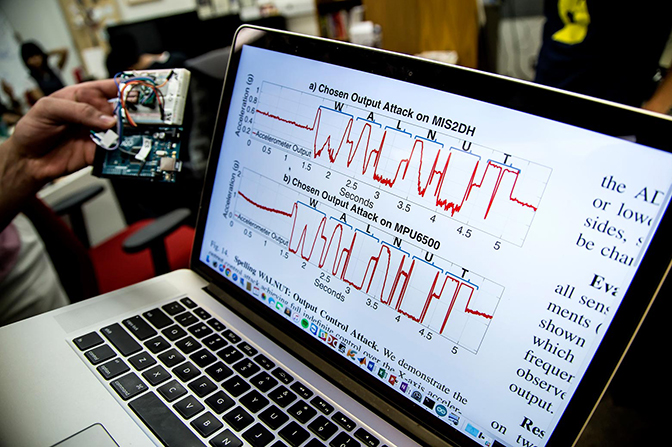 Laptop screen displaying frequency waves