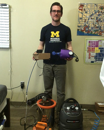 Grad student Dan Bruder with simple ventilator design