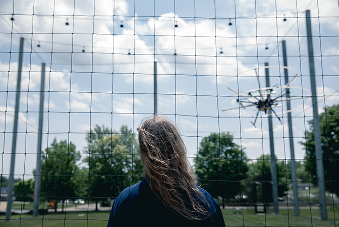 Image of Atkins observing octocopter in the air