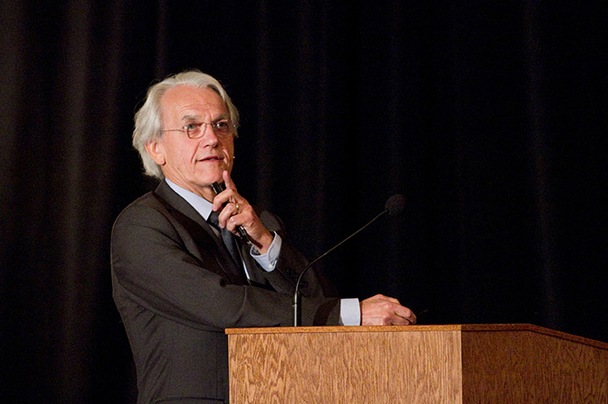 image of gerard mourou speaking at a symposium for the discovery of nonlinear optics