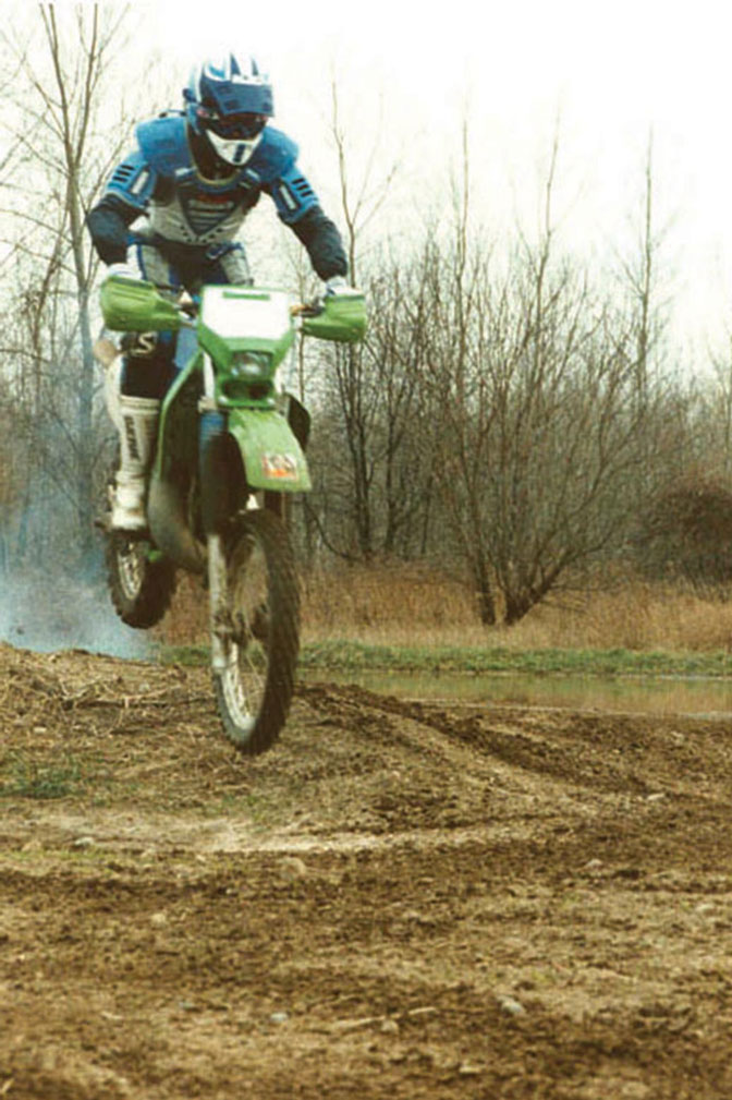 lynn conway mid-air on a dirt bike