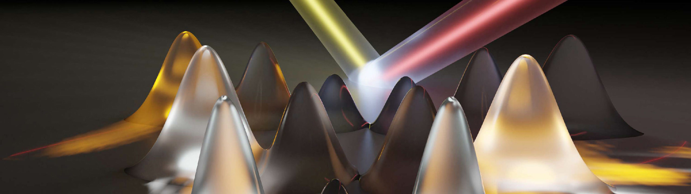 The electrons absorb laser light and set up “momentum combs” (the hills) spanning the energy valleys within the material (the red line). When the electrons have an energy allowed by the quantum mechanical structure of the material—and also touch the edge of the valley—they emit light. This is why some teeth of the combs are bright and some are dark. By measuring the emitted light and precisely locating its source, the research mapped out the energy valleys in a 2D crystal of tungsten diselenide.