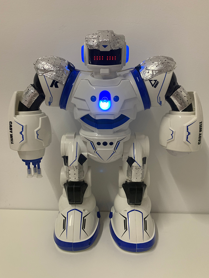 Image of a robot with new biomorphic zinc-air batteries applied as patches over the robot's knees, shoulders, elbows and head.