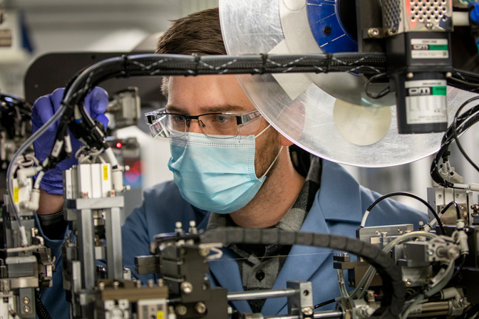 Eric Kazyak, a research fellow in mechanical engineering at U-M, works on solid state batteries—batteries that replace the liquid electrolytes found in traditional lithium-ion powered EVs with a solid electrolyte. By switching to a solid-state electrolyte, researchers are looking to improve the safety of EV batteries.