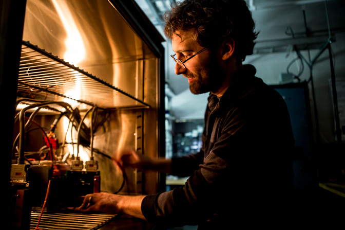 Jason Siegel, a U-M assistant research scientist in mechanical engineering, models a lithium-ion battery in the Fuel Control Systems Laboratory in the Automotive Research Center on North Campus.