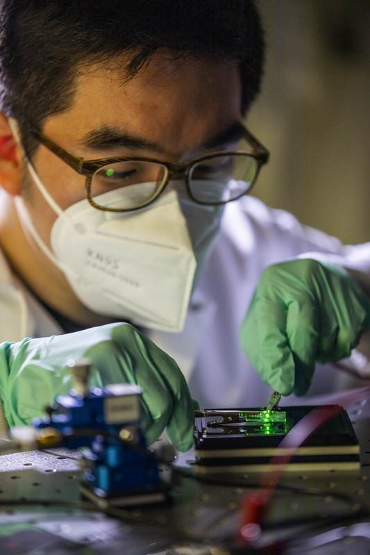 Changyeong Jeong, PhD Candidate in Electrical and Computer Engineering, handles an ultrathin Ag film based OLED inside Professor Jay Guo’s lab.