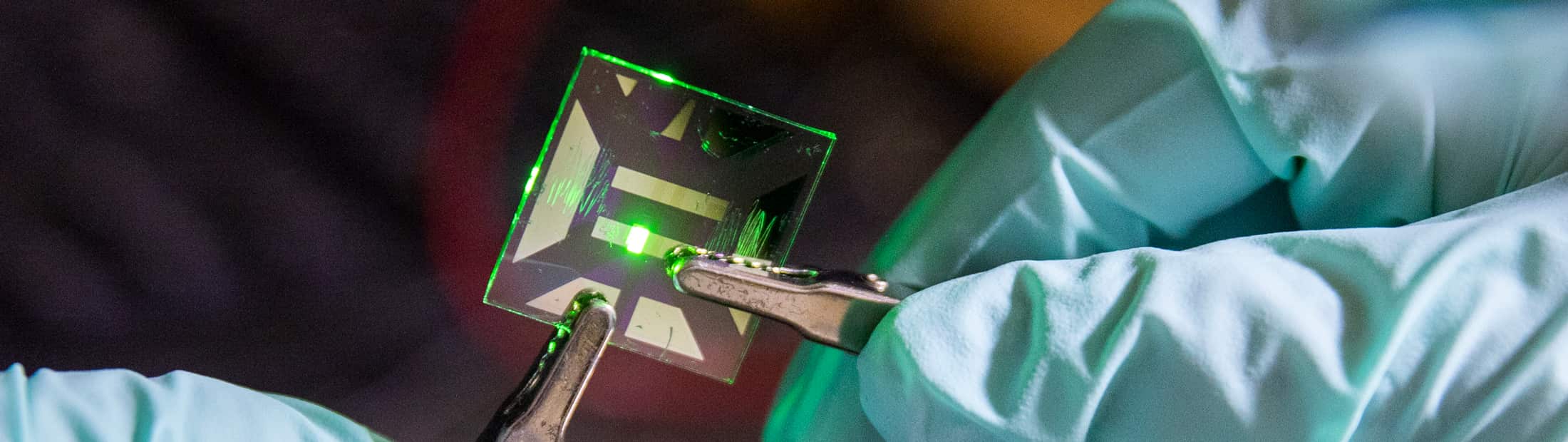 Changyeong Jeong, PhD Candidate in Electrical and Computer Engineering, handles an ultrathin Ag film based OLED inside Professor Jay Guo’s lab.