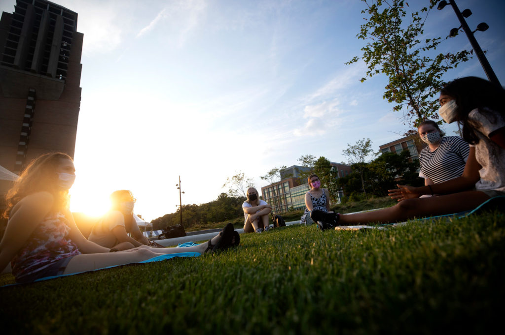 A group of Women in Science and Engineering (WISE) program members hang out on the Eda U. Gerstacker Grove on North Campus. Photo: Joseph Xu/Michigan Engineering