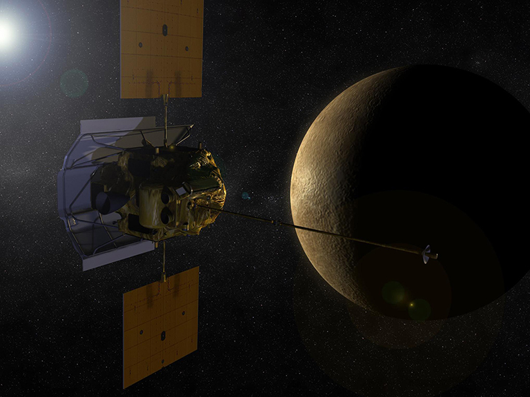 The MESSENGER spacecraft, which houses the Fast Plasma Imaging Spectrometer, or FIPS) passing over Mercury.