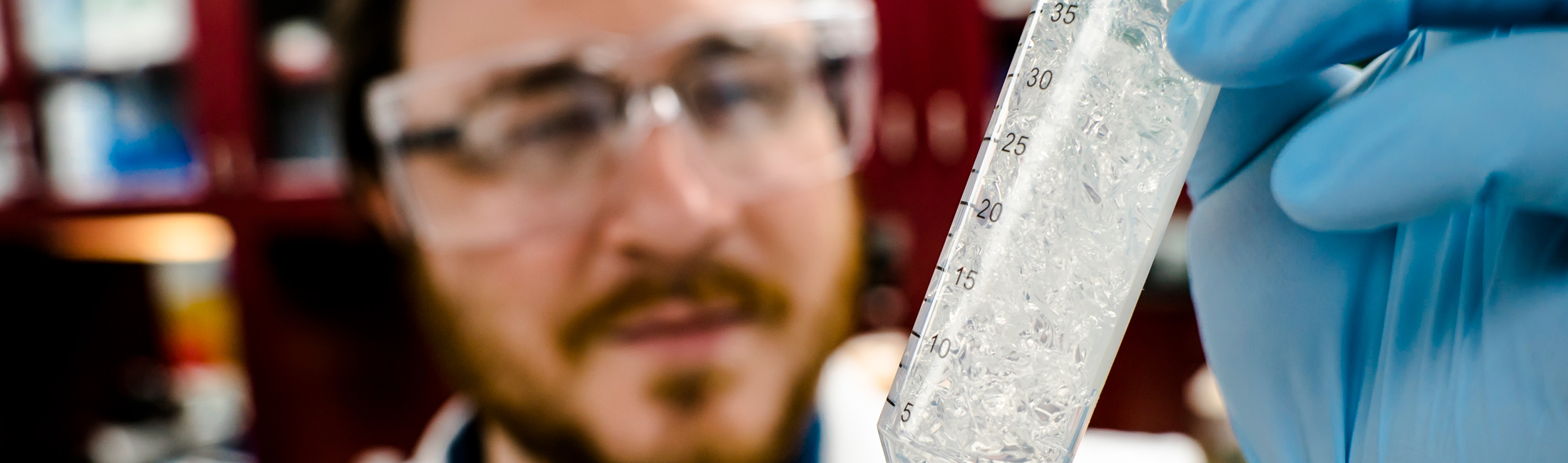 Jeremy Minty, a 2013 Ph.D. graduate of Michigan Engineering and co-founder of Ecovia Renewables, holds up a sample of the company's AzuraGel product in 2018. Minty participated in NSF's I-Corps program. Ecovia is developing a compostable biopolymer cosmetics. One of its uses could be in compostable diapers. Photo: Evan Dougherty/Michigan Engineering Communications & Marketing