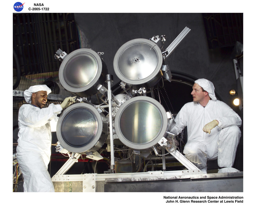 In 2005, John Foster (left) and Jonathan Van Noord (right) set up four NEXT thrusters to run in an array, simulating a mission to Saturn’s moon Titan. Credit: NASA