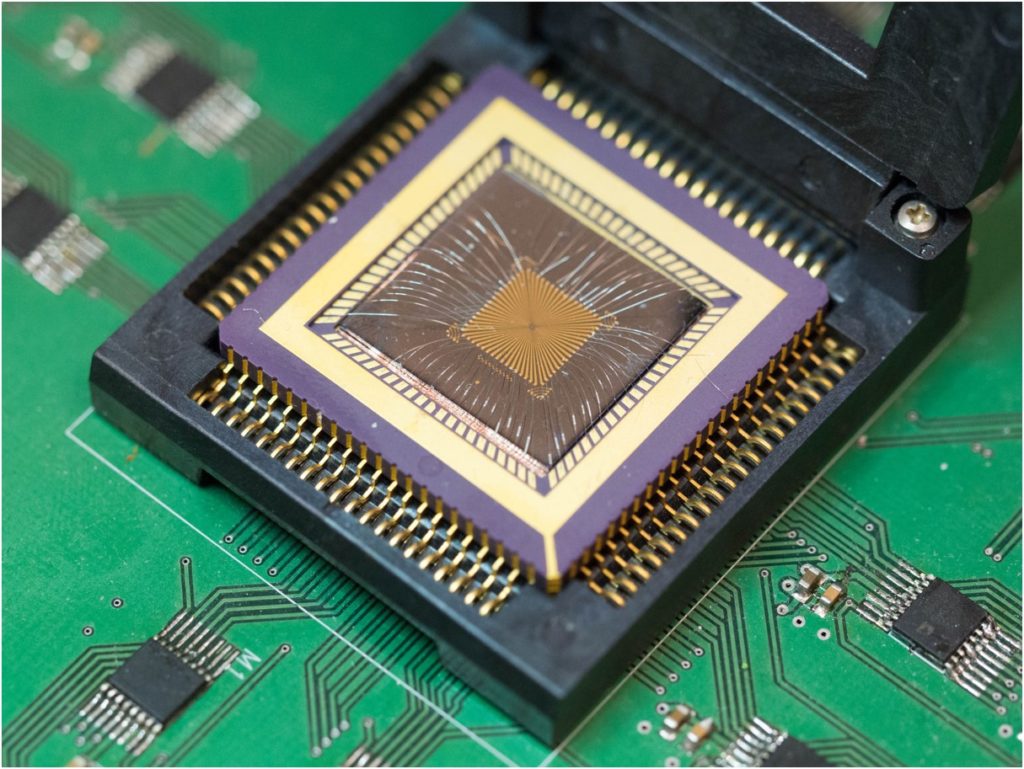 The memristor chip that powers the new reservoir computing system. Photo: Wei Lu.