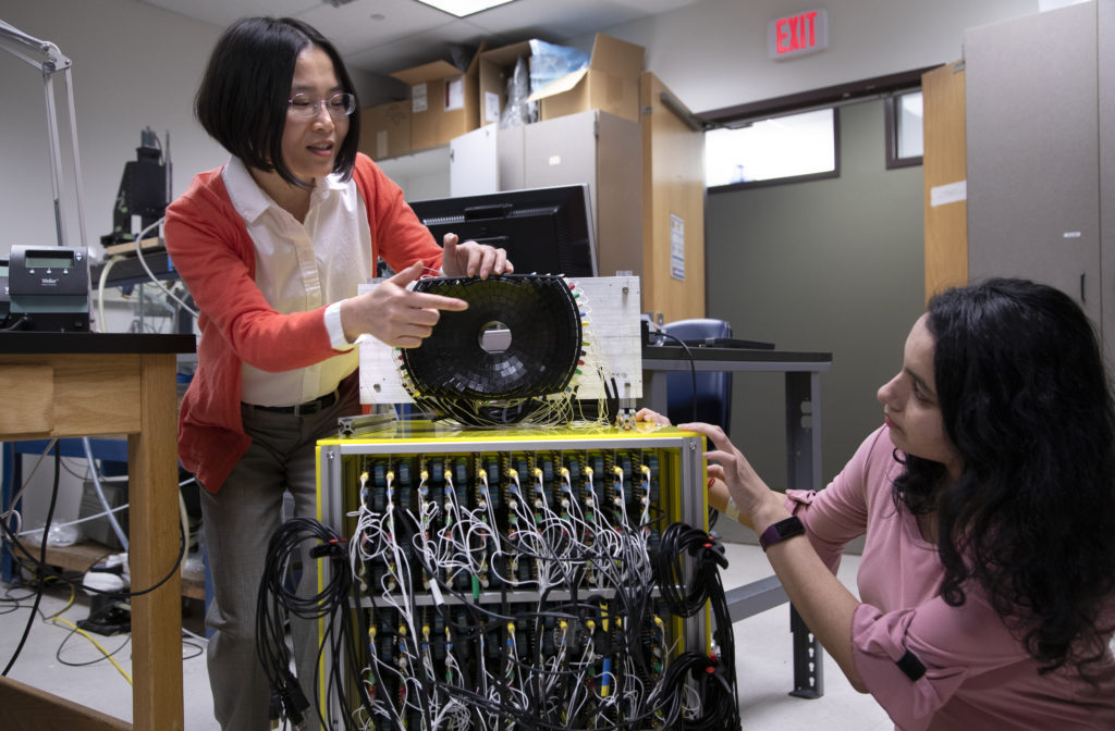 Zhen Xu and Tejaswi Worlikar using the the 700kHz, 260-element histotripsy ultrasound array transducer