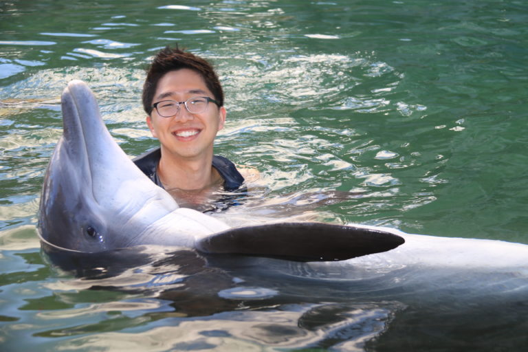 YeonJoon Cheong working with a dolphin. 