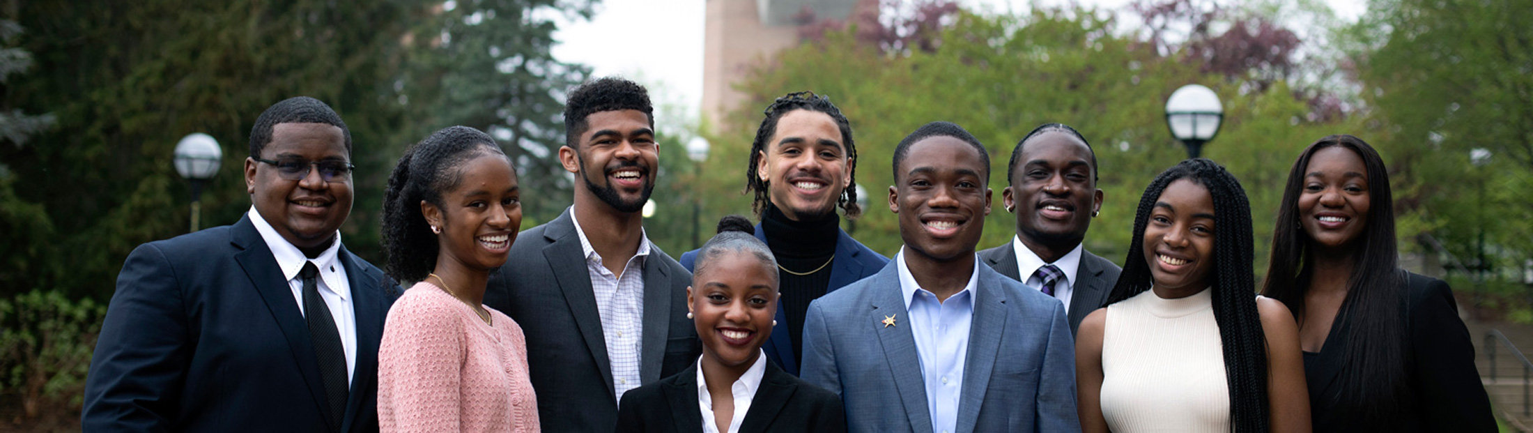 Members of the NSBE Chapter Executive Board pose for photos in front of the reflection pool on North Campus. Photo: Marcin Szczepanski/Michigan Engineering