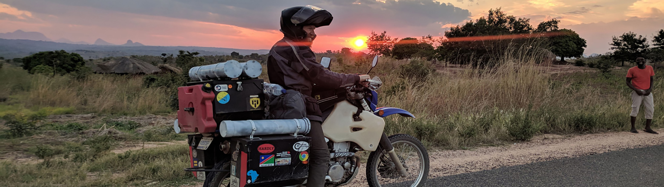 Image of Michigan Engineer Levi Weintraub on his motorbike enjoying the sunset near Nampula, Mozambique