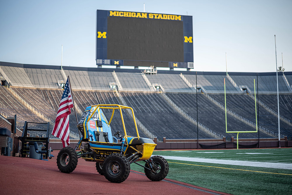 Baja car on the field at Michigan Stadium, summer day