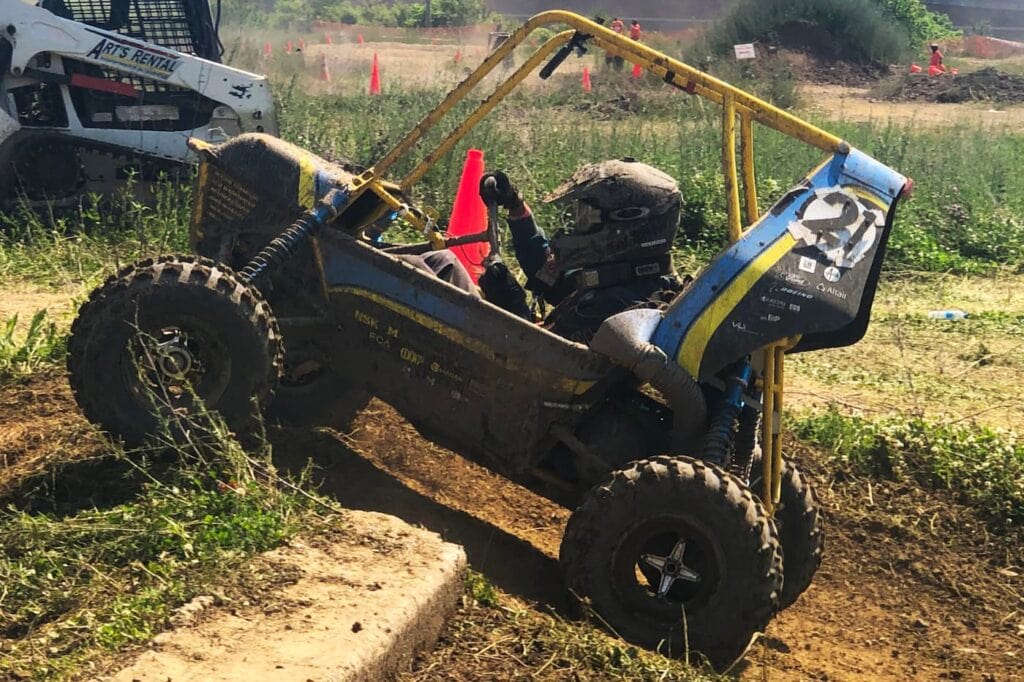 image of Baja car competing in obstacle course