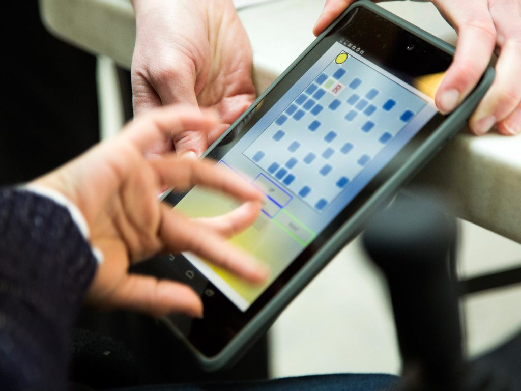 person testing accessibility of a tablet