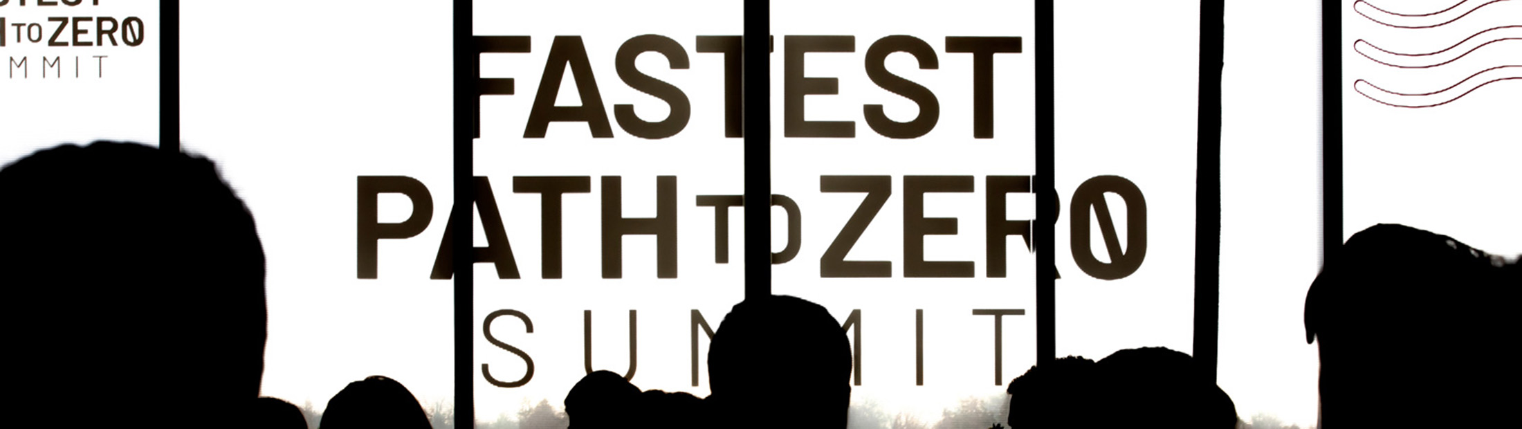 Silhouettes of people in a crowd with "Fastest Path to Zero Summit" written at the front.