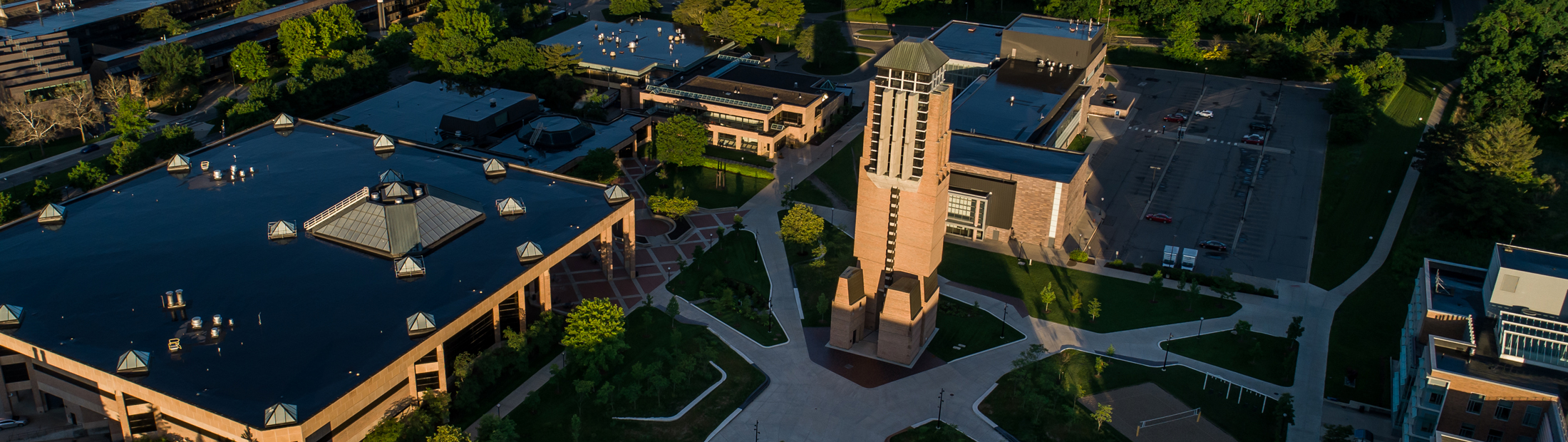 An aerial shot of North Campus at dawn, with orange light illuminating the Grove.