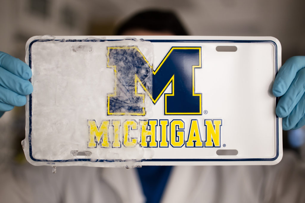 Kevin Golovin, a graduate student in materials science and engineering at U-M, demonstrates a new rubbery material that can create ice repelling, or "icephobic," coatings on a variety of materials, such as windshields or ship hulls.
