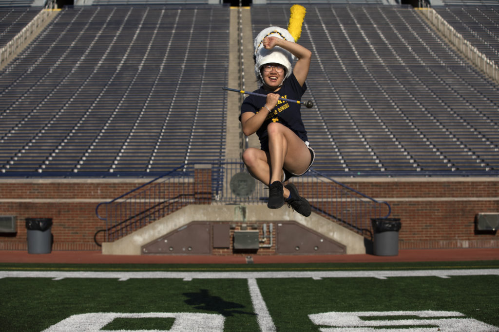 Photographed in the Big House at the end of June, Rachel Zhang is an honors biomedical engineering student and a new 2022/23 drum major at the UM Marching Band.