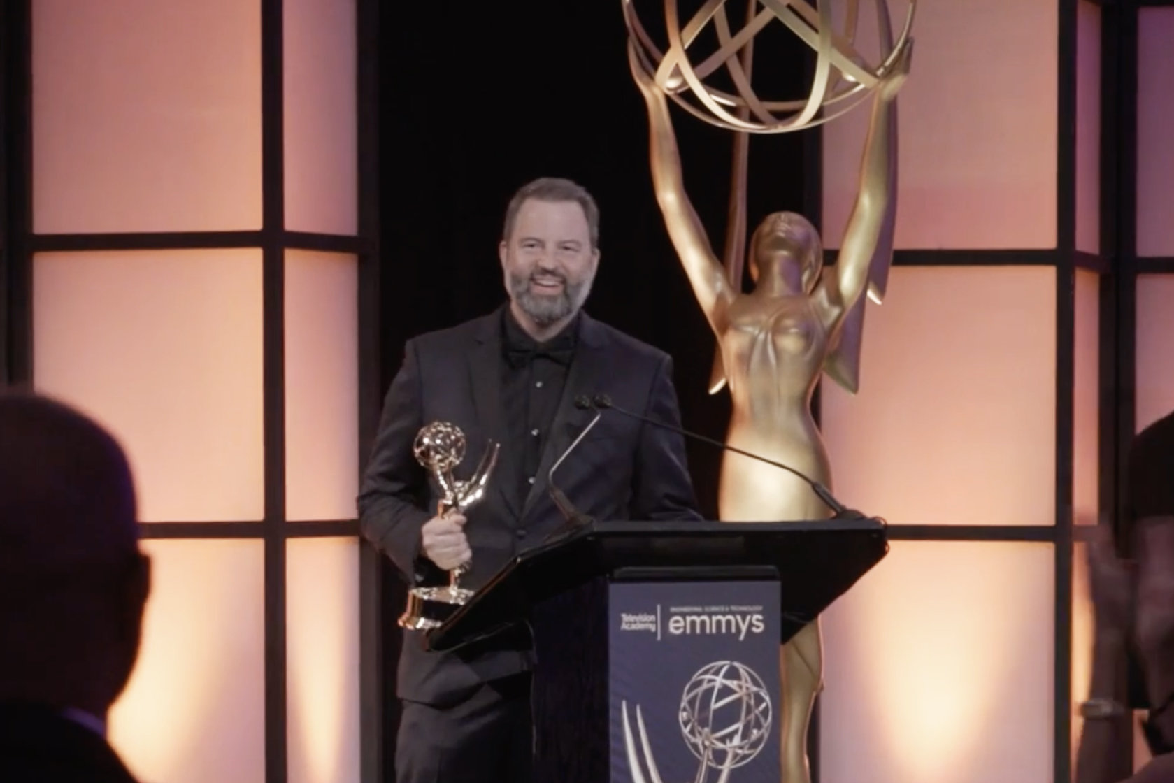Paul Debevec accepting his Emmy onstage at the Emmy Awards