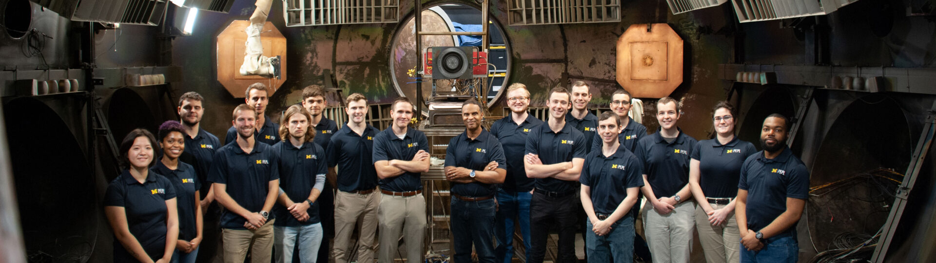 Alec Gallimore, Ben Jorns and PEPL researchers stand in the vacuum chamber