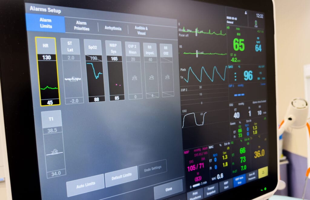 Alt text: A computer screen shows a patient's medical records, including many colorful graphs of vital signs.