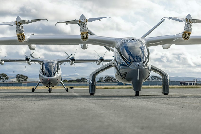 Two aircrafts that have four propellors - two on each wing - and a centralized cabin that can hold up to four passengers.