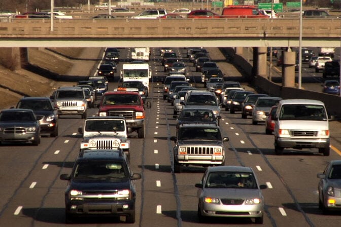 Oncoming traffic on a four-lane highway.