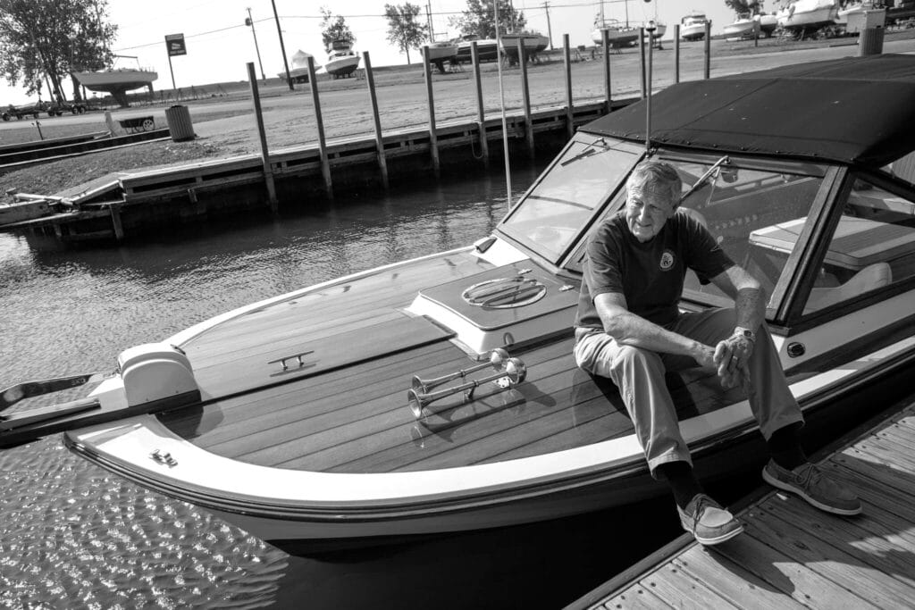 Chaffin sits on the bow of his boat