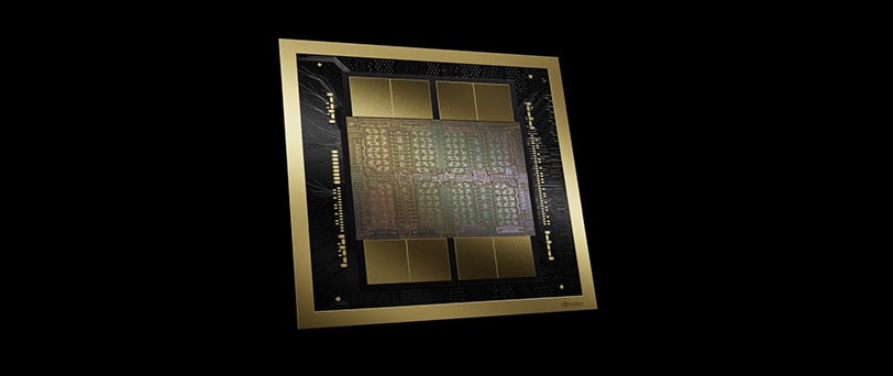 A close-up of a computer chip, framed in gold, showing intricate, iridescent architecture, gold circuitry and rectangular modules.