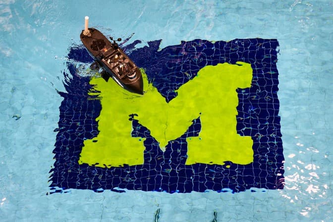 UM Autonomous Boat Competition vehicle is on display in the pool during the SeaPerch competition.